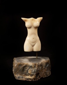 A carved marine ivory torso mounted on stone base, 20th century, 11.5cm overall