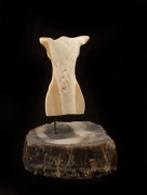 A carved marine ivory torso mounted on stone base, 20th century, 11.5cm overall - 2