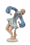 GOLDSCHEIDER&nbsp;porcelain statue of a dancing lady in blue dress, stamped "Vienar Marnfektur, T. Schuster, Made in Germany", 34.5cm high