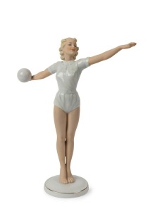 SCHAUBACH KUNST German Art Deco porcelain statue of a female volleyball player, green factory mark to base, 28cm high