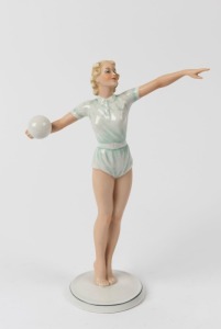 SCHAUBACH KUNST German Art Deco porcelain statue of a female volleyball player, green factory mark to base, 24.5cm high