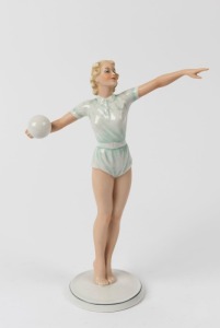 SCHAUBACH KUNST German Art Deco porcelain statue of a female volleyball player, green factory mark to base, 24.5cm high