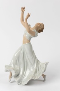 SCHAUBACH KUNST German Art Deco porcelain statue of a dancing lady with arms raised, green factory mark to base, 31cm high