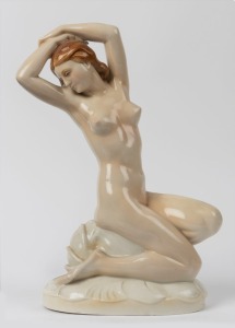 A German Art Deco porcelain statue of a kneeling female nude, signed "D. W. Goebel" 33cm high