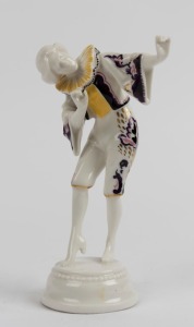 HUTSCHENREUTHER German porcelain statue of a dancing lady with yellow and purple costume, green factory mark to base, 17cm high