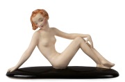 GOLDSCHEIDER&nbsp;Art Deco porcelain statue of reclining&nbsp;female nude, black factory mark "Goldscheider, Wien, Made in Germany", 20cm high, 34cm long