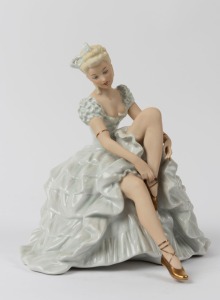 SCHAUBACH KUNST German porcelain statue of a seated lady in blue gown, green factory mark to base, 24cm high