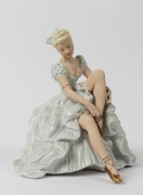 SCHAUBACH KUNST German&nbsp;porcelain statue of a seated lady in blue gown, green factory mark to base, 24cm high