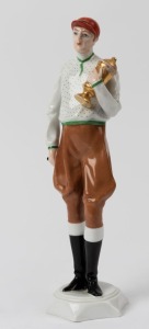 PIRKENHAMMER Czechoslovakian porcelain statue of a jockey with trophy, green factory mark to base, 24.5cm high