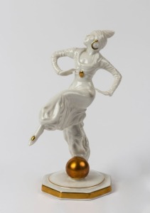HUTSCHENREUTHER German Art Deco white porcelain statue of dancing woman with golden orb, green factory mark to base, 18cm high