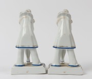 A pair of German porcelain Pierrot figural bookends, stamped "Foreign", 18.5cm high - 2