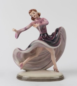 ROYAL BELVEDERE Austrian porcelain statue of a dancing lady in a purple dress, black factory mark to base "Royal Belvedere, Vienna, Made in Austria, Dakon", 17cm high