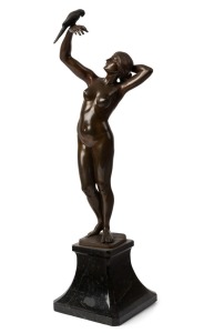 GOTTHILF JAEGER (1871-1933), lady with a bird, bronze statue on black marble base, signed "Jaeger", 56cm high overall