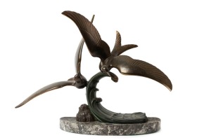 A French Art Deco seagull statue, patinated spelter on marble base, circa 1930, 44cm high, 56cm wide