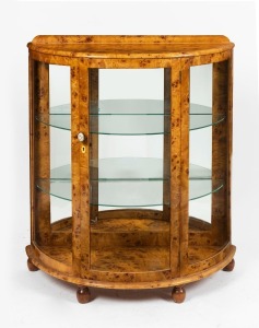 An Art Deco demi lune display cabinet, Karelian birch, mid 20th century, 109cm high, 95cm wide, 41cm deep