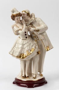 ROYAL DUX Bohemian porcelain figural group with gilded highlights and burgundy base, pink triangle mark to base, 30.5cm high