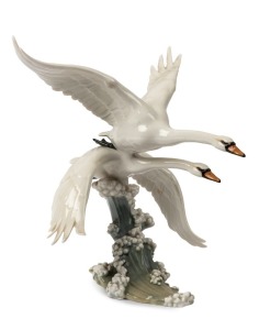 HUTSCHENREUTHER German porcelain flying swans statue, green factory mark to base with original paper label, 31cm high, 25cm wide