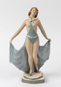 Czechoslovakian porcelain statue of a lady in a blue dress, circular factory mark to base "Made in Czechoslovakia", 30cm high