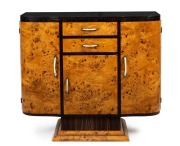 An Austrian Art Deco sideboard,&nbsp;Karelian birch and macassar ebony with black marble top and ivorine handles, circa 1925, 93cm high, 107cm wide, 37cm deep