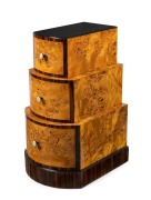 An Austrian Art Deco three drawer waterfall chest of drawers,&nbsp;Karelian birch and macassar ebony with ivorine&nbsp;handles, circa 1925, ​​​​​​​90cm high, 50cm wide, 56cm deep