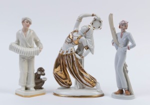 Group of three Continental Art Deco porcelain statues comprising dancer with tambourine, accordion player and skiing woman, the largest 22cm high