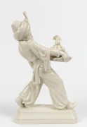 A Continental white porcelain statue of a Blackamoor carrying fruit, impressed pictorial fox mark to base, signed "H. Meisel", 30cm high - 2