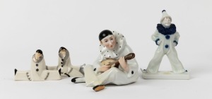 Continental porcelain statue of Pierrot flute player together with a ROSENTHAL clown statue signed "Ferd. Liebermann" and a pair of SEVRES porcelain figural knife rests, (4 items), the largest 15.5cm high