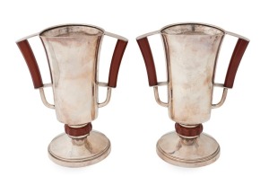 A pair of English sterling silver Art Deco mantle urns with bakelite fittings, made by S. Blanckensee & Son Ltd. of Chester, Circa 1934, 24.5cm high, 20.5cm wide, 1394 grams total