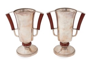 A pair of English sterling silver Art Deco mantle urns with bakelite fittings, made by S. Blanckensee & Son Ltd. of Chester, Circa 1934, 24.5cm high, 20.5cm wide, ​​​​​​​1394 grams total