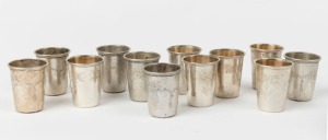 A set of twelve Continental silver schnapps beakers, ​​​​​​​marks rubbed, 4.5cm high, 130 grams total