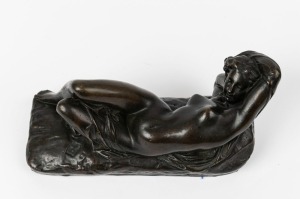 An antique French bronze statue of a reclining female nude, 19th/20th century, foundry button mark near base, ​​​​​​​13cm high, 25cm wide