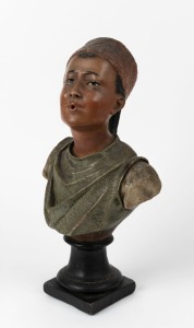 An antique painted chalkware statue of a boy wearing a fez, 19th/20th century, Note: missing cigarette, 48cm high