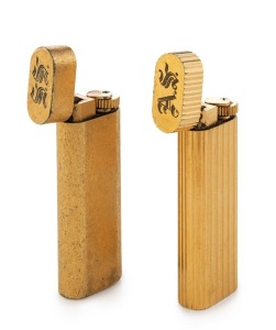 CARTIER: two vintage gold plated cigarette lighters, both engraved with ownership monograms "A.S." and "S.S.", 7cm high