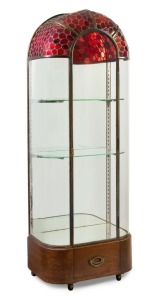 A stunning Art Deco vitrine display cabinet with rouge lead light decoration, nickel and glass shelving, brass trim on a walnut base, circa 1925, 195cm high, 70cm wide, 41cm deep