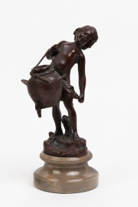 A bronze statue of a boy holding a basket, mounted on gray stone plinth, 20th century, ​​​​​​​26cm high