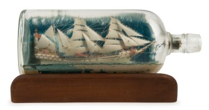 A vintage model ship in bottle, early 20th century, 29cm long