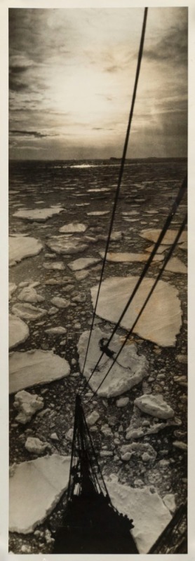 THE B.A.N.Z. ANTARCTIC EXPEDITION: Official original photograph by Captain Frank Hurley: Image A50 - Title: "Into the Eye of the Midnight Sun", with official "MAWSON ANTARCTIC EXPEDITION" handstamp and release date "TUESDAY MAY 6, 1930" verso, together wi