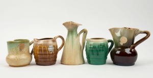 REMUED five assorted pottery jugs, the largest 14cm high