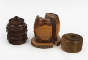 A pair of mulga wood barrel bookends and two timber canisters, 20th century, the largest 15cm high