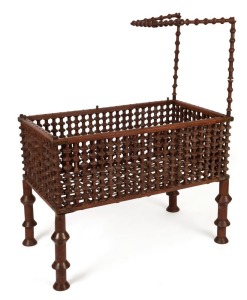 An antique Australian Depression era baby's cot, cotton reel construction with iron work strapping, circa 1890s, ​​​​​​​135cm high, 108cm wide, 62cm deep