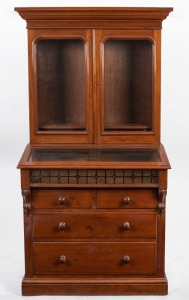 An antique Australian cedar bookcase with sloping display top and four drawer base, circa 1880, ​​​​​​​192cm high, 96cm wide, 54cm deep