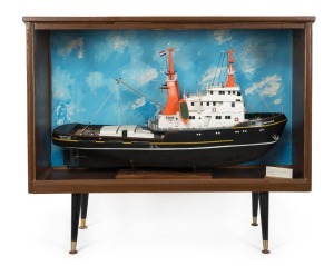 The AMSTERDAM scratch built-tugboat in case, 20th century, 57cm high, 100cm long, the cabinet 98cm high, 115cm long