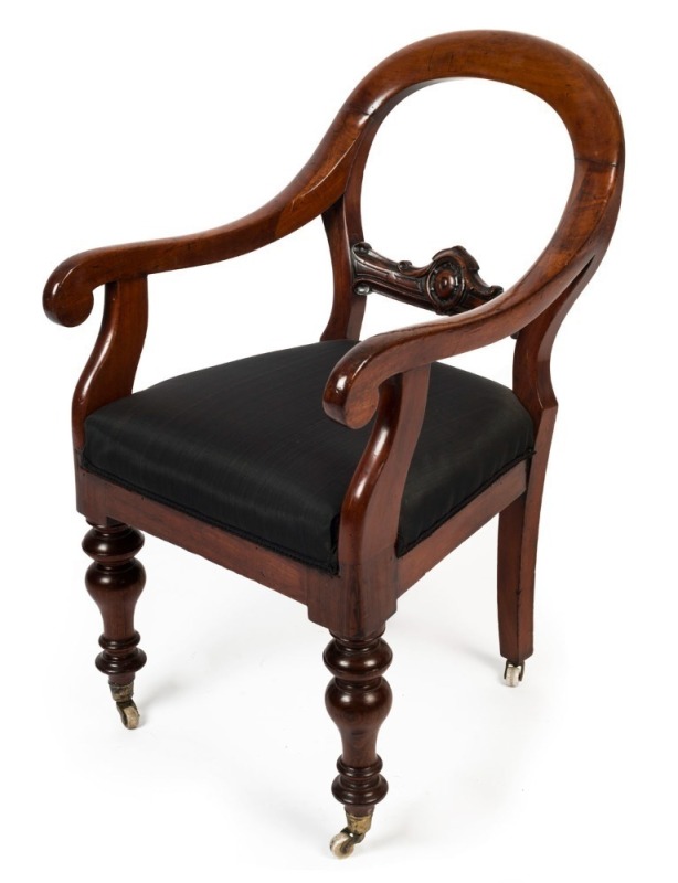 A Colonial cedar library armchair, circa 1865, ​​​​​​​95cm high, 53cm across the arms