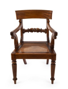 A fine antique Colonial cedar carver chair with reeded legs, in the Regency style, Tasmanian origin, early 19th century. Illustrated in "A Guide To Collecting Australiana" by Juliana and Toby Hooper (fig. 38). 89cm high, 57cm across the arms. PROVENANCE: 