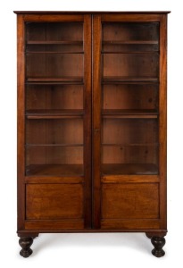 An antique Colonial Australian cedar two door bookcase on turned legs, Tasmanian origin, 19th century, ​​​​​​​174cm high, 101cm wide, 33cm deep