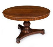 A Colonial Australian cedar supper table in the Regency style with tri-form platform base adorned with finely turned rondels. New South Wales origin, circa 1835, 75cm high, 124cm diameter