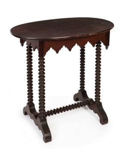 An Australian Folk Art oval occasional table, stained pine and cedar with bobbin turnings and unusual apron frieze, South Australian origin, 19th century, 71cm high, 73cm wide, 46cm deep