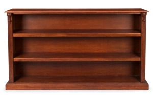 An Australian hardwood open-front bookcase in the antique style with carved corbels, late 20th century, ​​​​​​​112cm high, 195cm wide, 35cm deep