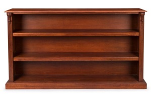 An Australian hardwood open-front bookcase in the antique style with carved corbels, late 20th century, 112cm high, 195cm wide, 35cm deep