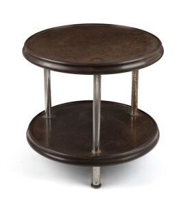 An Art Deco bakelite and metal two tiered occasional table, circa 1935, note pitting to chrome,  37cm high, 51cm diameter